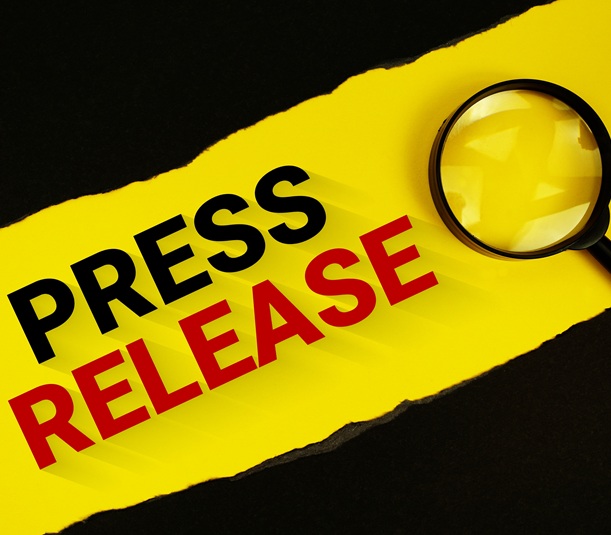 Press release and magnifying glass