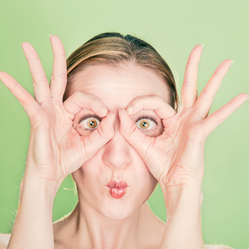 woman looking though glasses